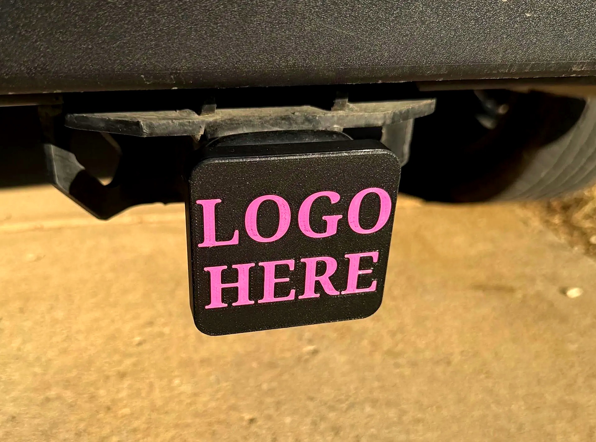 Custom 3D printed trailer hitch cover installed in a 2-inch receiver